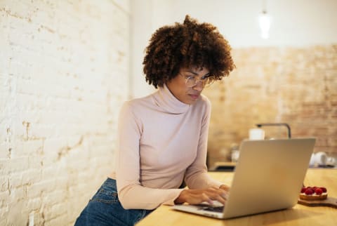 woman typing on computer