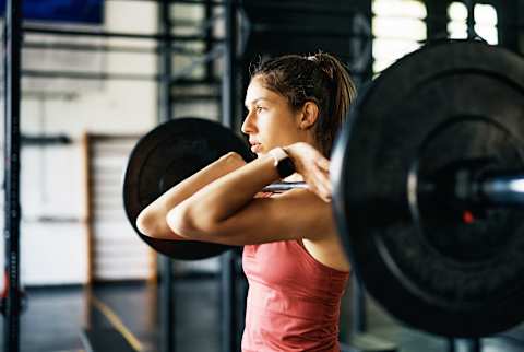 Woman holding heavy weights Woman holding heavy weights