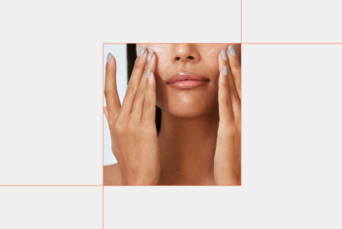 close-up image of woman applying skin care product to face with hands