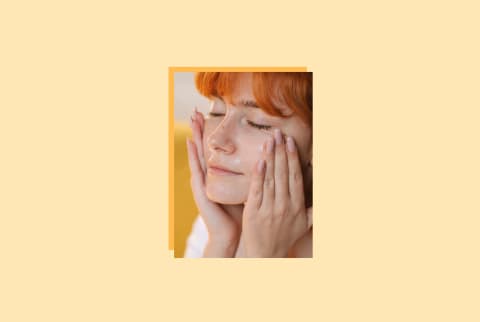 photo of woman with hands on her face on yellow background