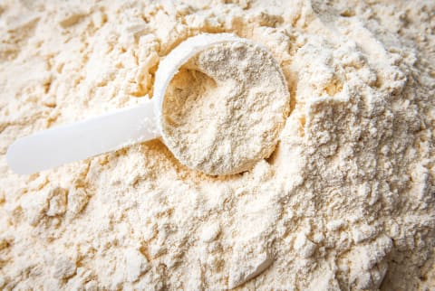 Plastic spoon in protein powder