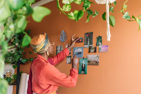 woman vision boarding on the wall