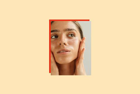 photo of woman applying skin care to her face on yellow background photo of woman applying skin care to her face on yellow background