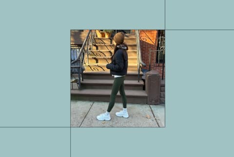 Women standing in front of stairs outside wearing white KLAW sneakers