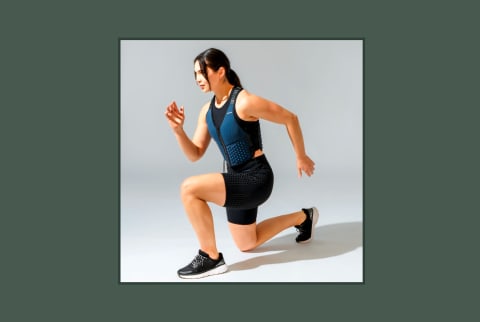 woman in workout clothes and weighted vest on background