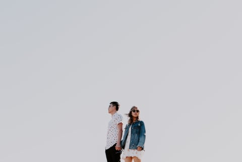 low angle shot of couple holding hands in desert