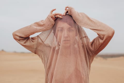 Young woman in desert alone