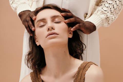 Woman receiving a relaxing scalp massage