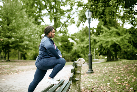 black woman stretching on a bench for her exercise black woman stretching on a bench for her exercise