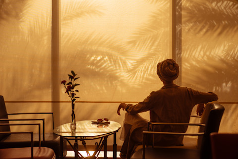 Woman sitting down in a relaxed environment Woman sitting down in a relaxed environment