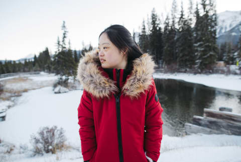  Young Woman Outside In Winter Wearing Red Coat.
