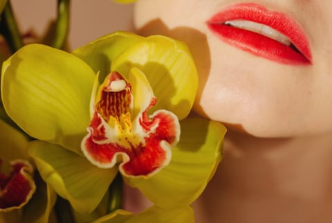 Woman red lips and orchid