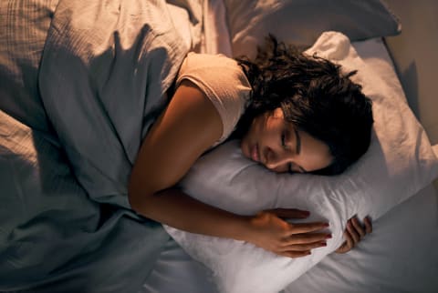 Sleeping woman with a soft back light