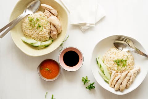 Chinese chicken rice dish with chili sauce and soy sauce