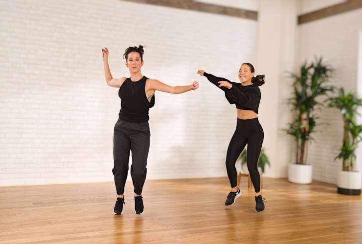 An 8-Minute Workout To Shake Off Your Stress & Dance Your Way Into 2022
