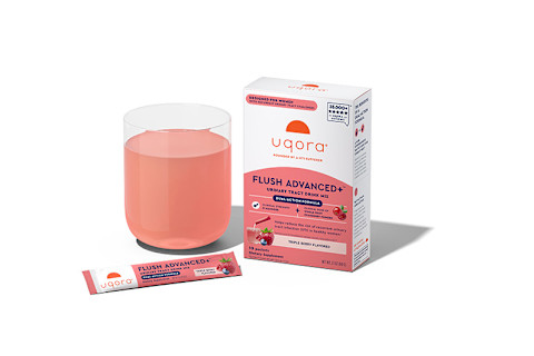 A glass of Uqora's Flush Advanced+ and the packaging beside it