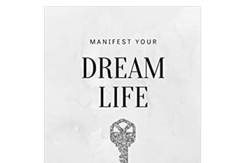 manifest your dream life book with key on cover
