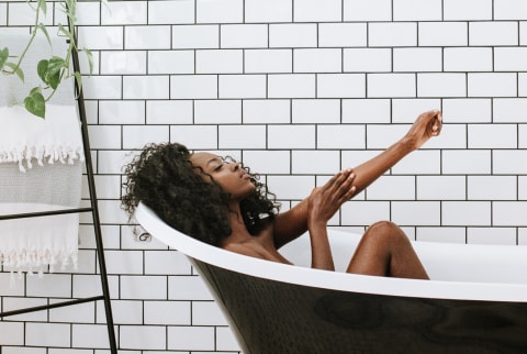 Woman Bathing in a Claw Foot Tub