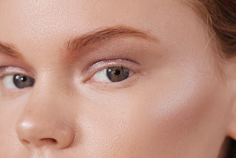 Close Up Beauty Shot of a Woman with Glowing Skin and Rosy Cheeks