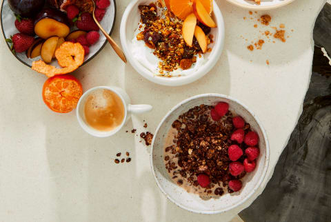 table with bowls of fruit and granola 