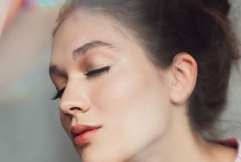 Young Woman With Her Eyes Closed and a Prismatic Overlay