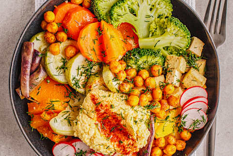 Grain Bowl Loaded With Chickpeas, Tofu, Broccoli, Carrots, and Hummus