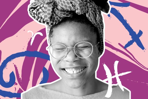Joyful woman smiling with astrology symbols