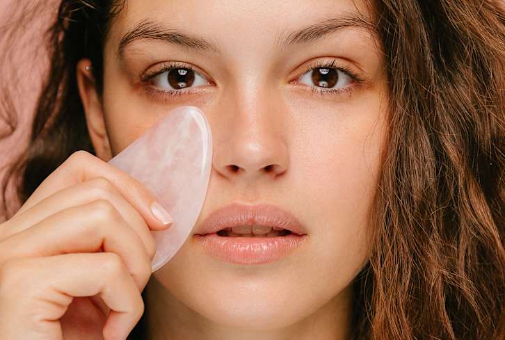 An Acupuncturist Taught Us A 6-Step Gua Sha Practice To Massage Stuffy Sinuses