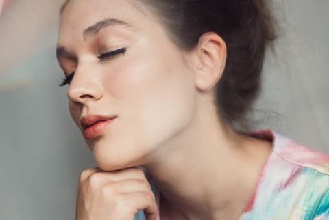 Peaceful Young Woman With Eyes Closed