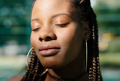 Portrait Of An African-American Woman With Eyes Closed