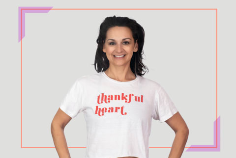 smiling woman with thankful heart t shirt