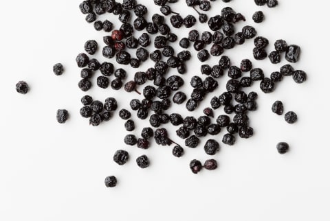 Dried Maqui berries superfood on white background