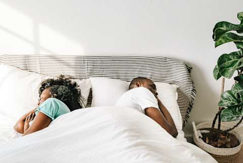 Distant Couple Sleeping in a Bed Distant Couple Sleeping in a Bed