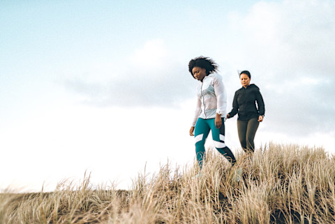 Women Walking Outdoors on a Windy Day