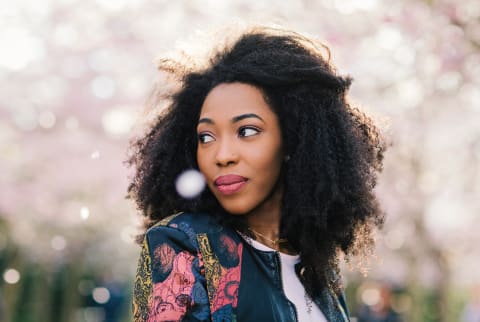 Woman in Springtime Looking Over Her Shoulder