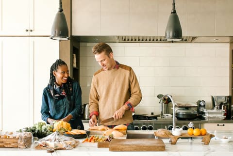 Interracial couple cooking a meal