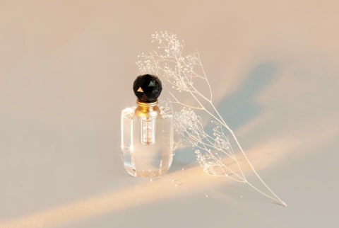 Perfume Bottle In Dappled Light