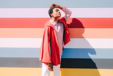 Distressed woman against colorful background