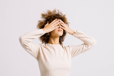 (Last Used: 2/9/21) Stressed Woman with Hands Over Her Eyes in a Studio