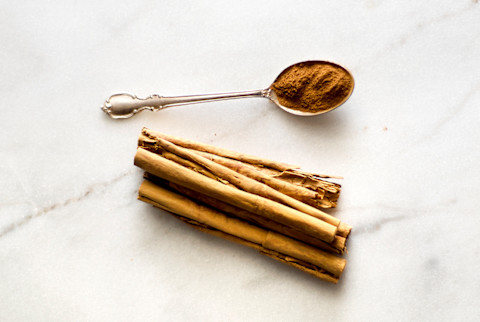 Overhead Photo of Cinnamon Sticks and Cinnamon Powder Overhead Photo of Cinnamon Sticks and Cinnamon Powder