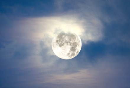 This Month's Full Moon Is A Rare Supermoon & Partial Lunar Eclipse