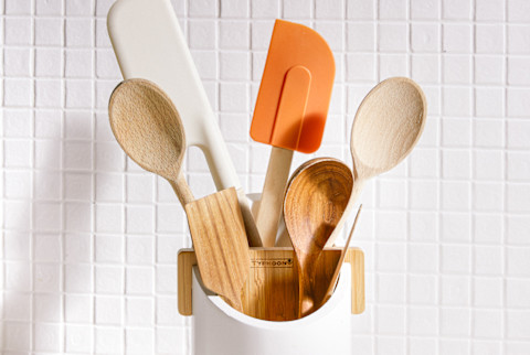 Silicone Spatulas and Wooden Spoons in a Crock on a Kitchen Counter
