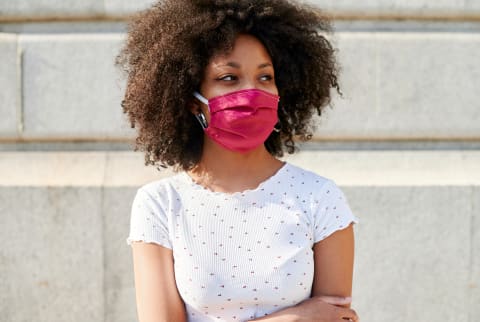 Young black woman in a mask