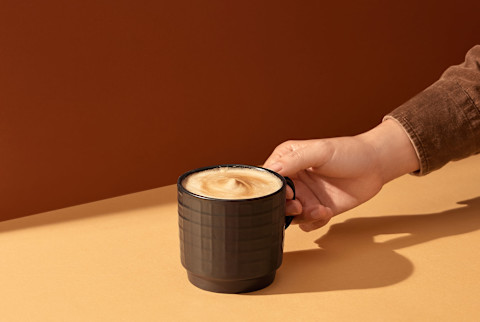 Man Holding In Hand Cappuccino Coffee Man Holding In Hand Cappuccino Coffee
