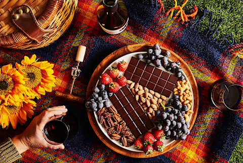 holiday spread with plate of chocolate, fruits, and nuts