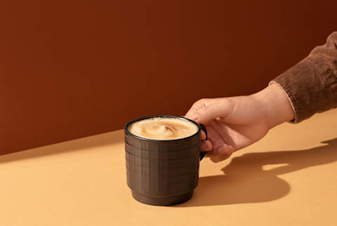 Man Holding In Hand Cappuccino Coffee