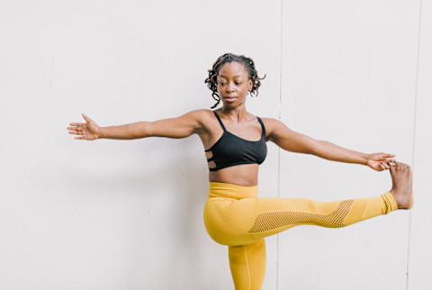 Woman Doing Yoga - Extended Hand to Big Toe Pose Woman Doing Yoga - Extended Hand to Big Toe Pose