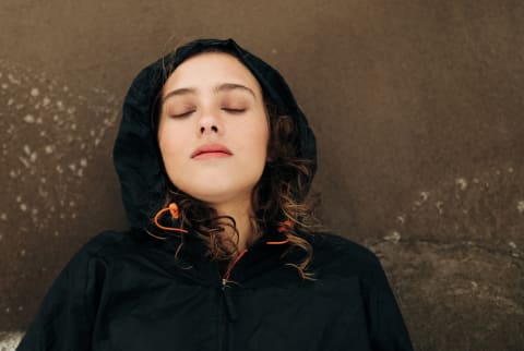 Young woman lying down stressed