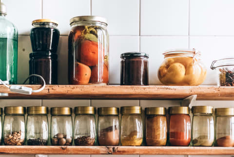 Kitchen Shelf with Spices, Canned Goods, and Cooking Utensils