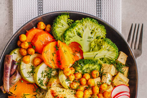 Grain Bowl Loaded With Chickpeas, Tofu, Broccoli, Carrots, and Hummus